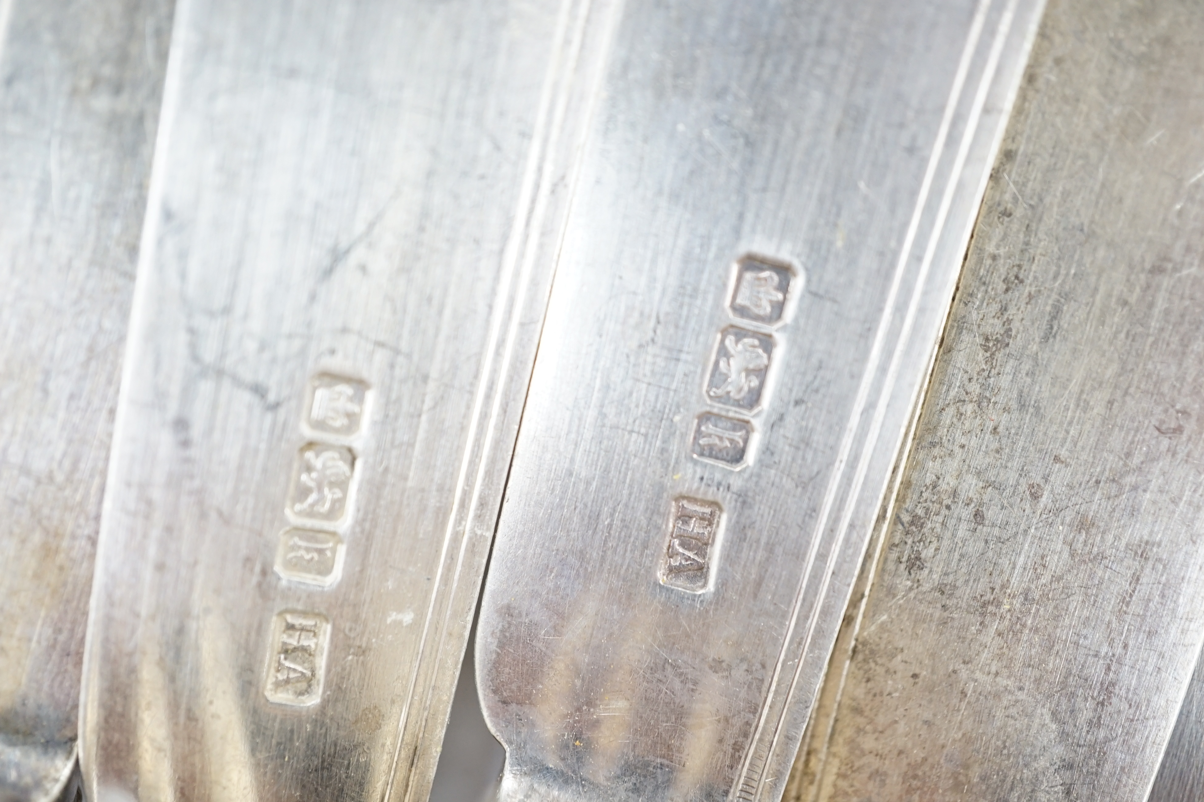 A pair of George IV silver fiddle pattern table spoons, William Bateman, London, 1824, six other later silver items of flatware, 7.5oz, together with six silver knife blades and five set of silver fork tines, gross 11.8o
